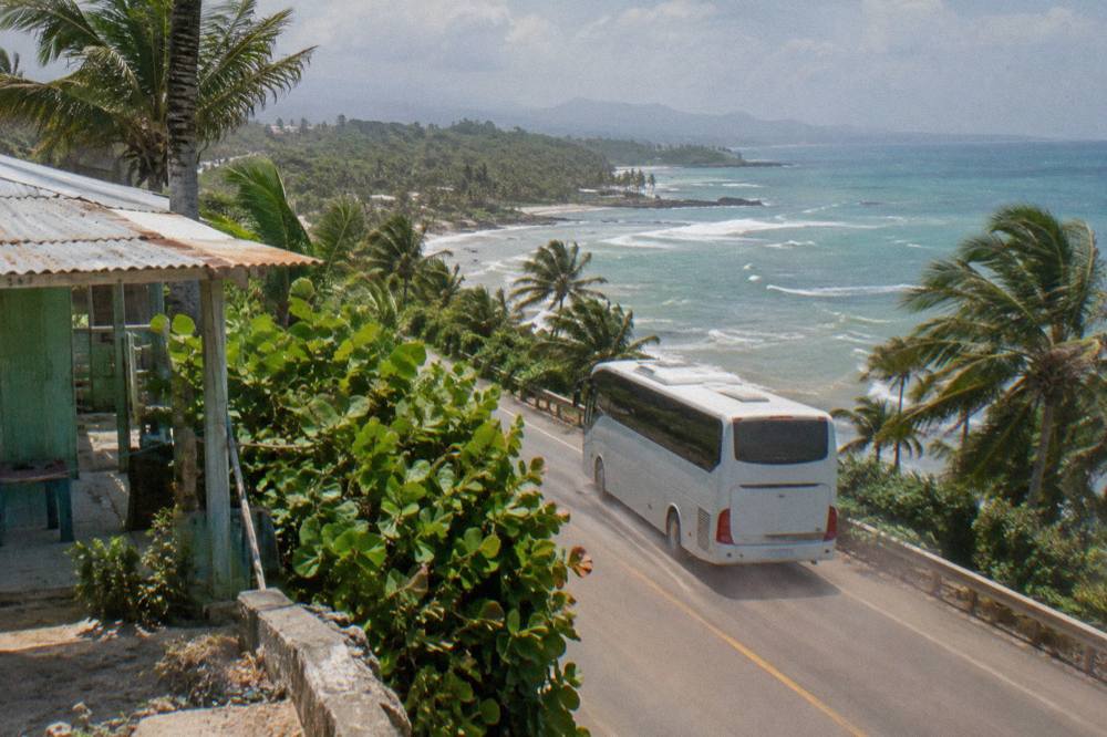 A coastal highway winding along green cliffs above the Caribbean in the Dominican Republic