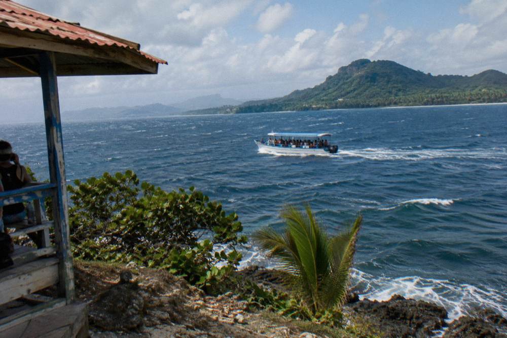 A whale-watching boat crossing open water in Samaná Bay