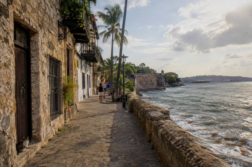 Colonial stone buildings and a narrow pedestrian street in Santo Domingo's old district