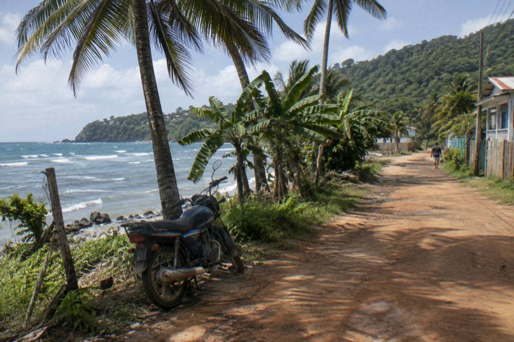 Simple open-air food stall beside a road on the Samaná peninsula
