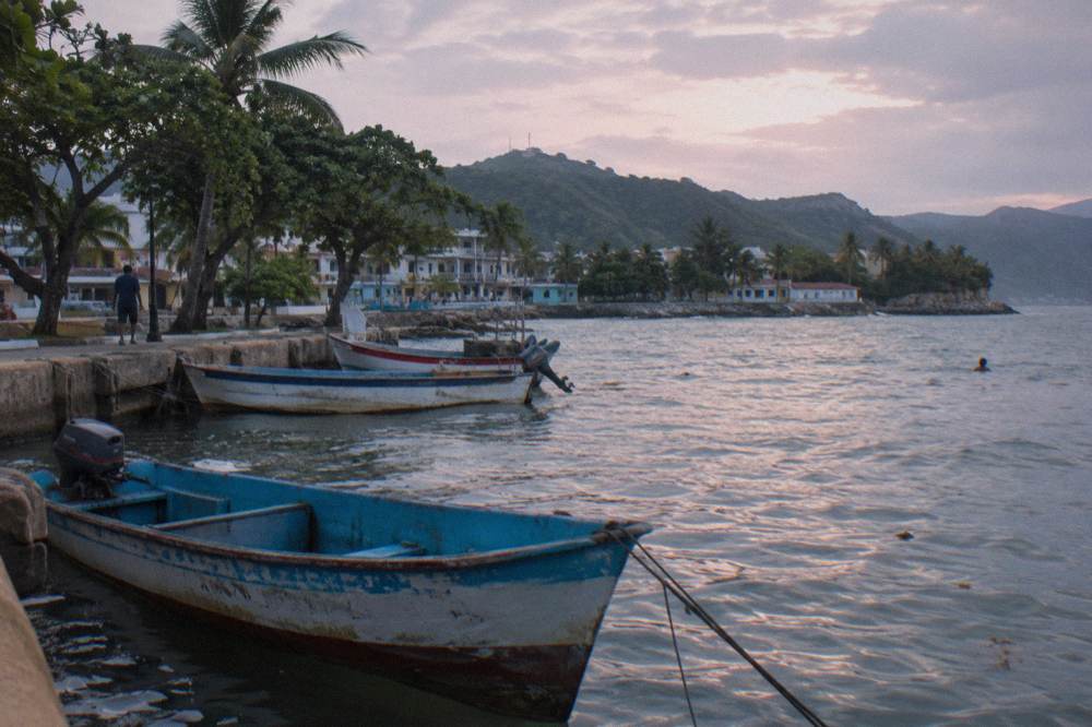 Early morning light on a quiet harbor with fishing boats moored