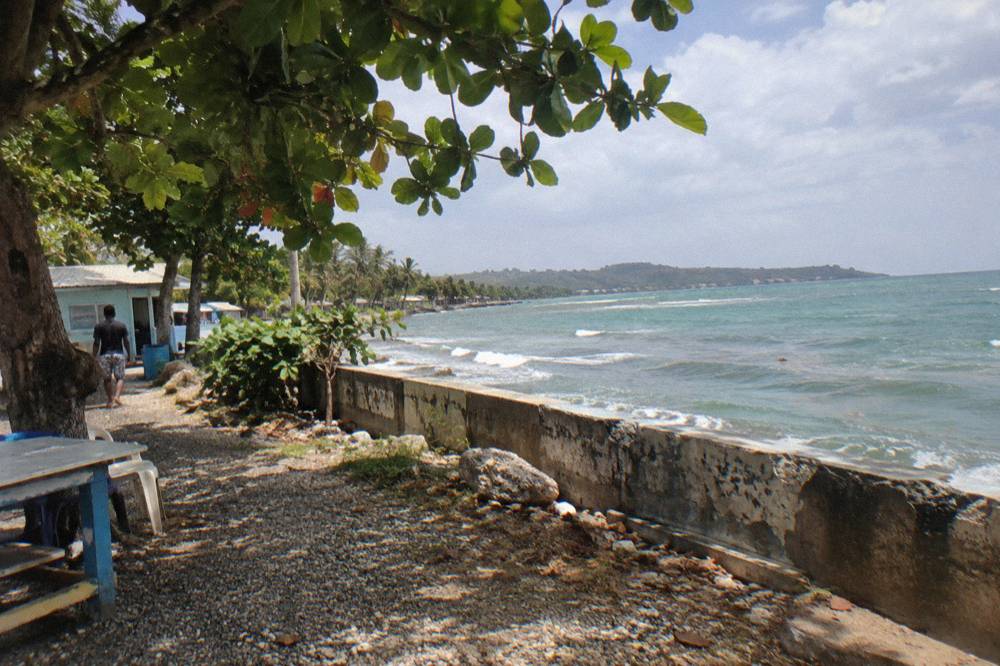 Tour coaches parked at a rest stop on the highway across the Dominican Republic